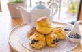 English breakfast and tea break. scones on wooden table with a cup of tea.