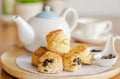 English breakfast and tea break. scones on wooden table with a cup of tea.