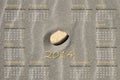English calendar 2014 with stone on sand