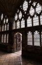 English Cathedral Stone floor, walls, glass and light coming through old wooden door Royalty Free Stock Photo