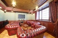 English cigar room with red leather armchairs