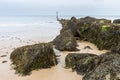 English coastal view, rocks pointing out to sea in Norfolk, UK