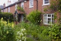 An English Cottage Garden in Warsash in Hampshire showing a riot of chaotic colour in early summer Royalty Free Stock Photo