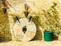 English cottage and old stone wheels Royalty Free Stock Photo