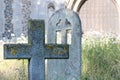 English country cemetary with ancient stone cross headstone in r Royalty Free Stock Photo