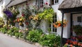 English country cottage decked with flowers Royalty Free Stock Photo