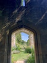 English country garden, secret garden through an archway on castle grounds Royalty Free Stock Photo