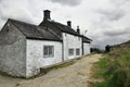 English countryside landscape: old house, clouds Royalty Free Stock Photo