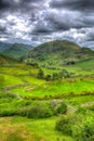 English countryside scene the Lake District with valley and mountains and green fields in HDR Royalty Free Stock Photo