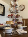 An English cream tea, with sandwiches and strawberries on a layered cake stand