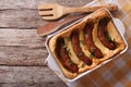 English food: toad in the hole into a baking dish. horizontal to