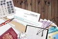 English form sa100 Tax return by HM revenue and customs lies on table with office items. HMRC paperwork and tax paying process in