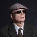 English gentleman in sunglasses and tweeds