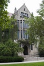 Building in English gothic style and trees