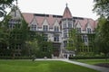 Building in English gothic style and trees