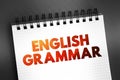 English Grammar - way in which meanings are encoded into wordings in the English language, text on notepad concept background