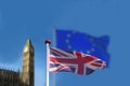 The English or Great Britain flag waving in front of a blurred EU European Union flag. Big Ben and Houses of Parliament seen in th Royalty Free Stock Photo