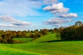English green meadow on a sunny day, a typical rural landscape o Royalty Free Stock Photo