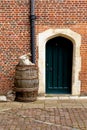 English heritage vintage background - Barrel in front of door entrance Royalty Free Stock Photo