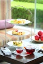 English high tea course with cupcake, muffin, apple and cream in Royalty Free Stock Photo