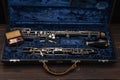 English horn or oboe in a case with reeds for playing on a wooden surface Royalty Free Stock Photo