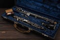 English horn or oboe in a case with reeds for playing on a wooden surface Royalty Free Stock Photo