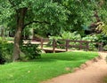 English landscaped garden with footbridge over a stream