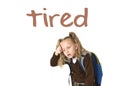 English language learning vocabulary school card with word tired and sweet beautiful little schoolgirl Royalty Free Stock Photo