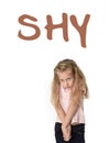 English language vocabulary school card with the word shy and a sweet little girl looking timid Royalty Free Stock Photo