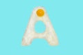 The letter A from a fried egg Royalty Free Stock Photo