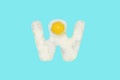The letter W from a fried egg Royalty Free Stock Photo
