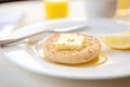 english muffin with melting butter on white plate Royalty Free Stock Photo