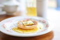 english muffin with melting butter on white plate Royalty Free Stock Photo