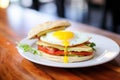 english muffin sandwich with bacon and egg Royalty Free Stock Photo