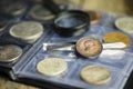 English old coin, magnifier and tweezers, numismatics Royalty Free Stock Photo