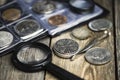 English old coin, magnifier and tweezers, numismatics Royalty Free Stock Photo