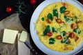 English Omelette with Butter and Tomatoes on Dark Background, Horizontal