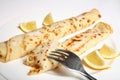 English pancake or crepe, sugar, lemon and fork Royalty Free Stock Photo