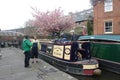 English people talking near a blue barge Barge on the docks of Manchester, UK