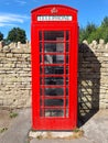 English Red Phone Box in village Royalty Free Stock Photo