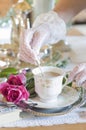 English retro still life and a woman's hand in a white lace glove stirring coffe Royalty Free Stock Photo