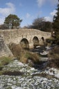 English river with old stone bridge on Dartmoor England UK