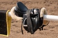 English saddle and bridle hanging on a wooden stable door UK