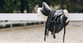 English saddle hanging on a wooden stable door Royalty Free Stock Photo