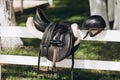 English saddle hanging on a wooden stable door Royalty Free Stock Photo
