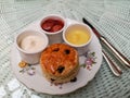 English scone with clotted cream, strawberry jam and lemon cream. Royalty Free Stock Photo