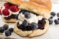 English scone with whipped cream, raspberry and blueberry