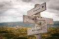 English, spanish and french wooden signpost outdoors. Royalty Free Stock Photo