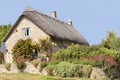 English stone cottage with colourful summer garden Royalty Free Stock Photo
