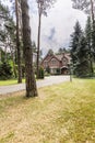 An English style house in a background seen from a front yard of Royalty Free Stock Photo